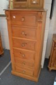 A tall pine six drawer chest.