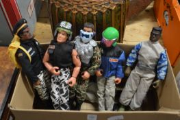 Five action man figures with a box of accessories.
