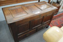 A good 18th century oak coffer bach with triple panelled top and front and two small drawers.