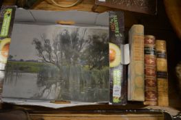 Three books and a small oil painting.