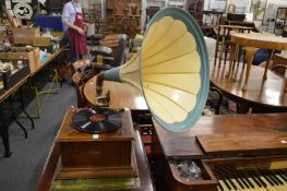 A Selecta oak cased wind-up gramophone with large painted horn and various records.