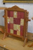 A pine framed fire screen.