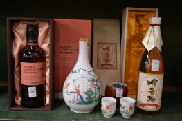 A bottle of Nikka coffee grain whisky, boxed and other items.