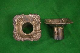 A pair of silver candle sconces.