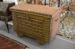 A large decorative Eastern brass bound wheeled marriage chest.