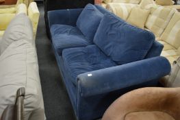 A dark blue upholstered two seater settee.