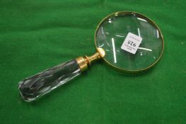 A decorative magnifying glass.