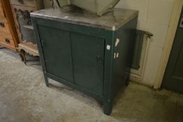 A painted metal storage cupboard.