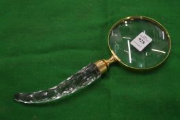 A decorative magnifying glass.