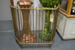 A brass folding fire screen.