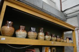 A collection of Royal Doulton salt glazed harvest jugs and similar items.