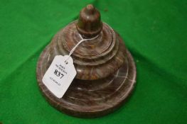 A turned marble inkwell and cover.