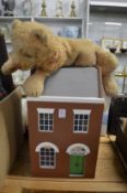 A dolls house and a cuddly toy/pyjama case.