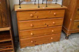 A pine four drawer chest.