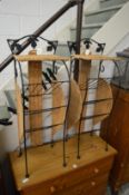Two small wicker and wrought iron magazines racks/stands.