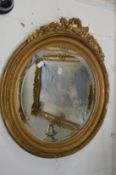 A good gilt framed circular wall mirror with decorative mouldings.
