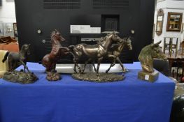 Four models of horses.