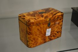 A Regency tortoiseshell two division tea caddy.