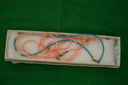 Coral and other jewellery.