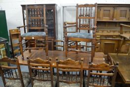 A pair of oak Lancashire spindle back armchairs and four similar single chairs.