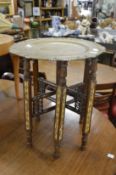 An Eastern brass tray table.