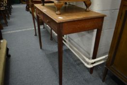 An oak two drawer side table, possibly Heals or similar.