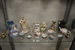 A good collection of decorative china to include teapot, black basalt jug, figurines etc.