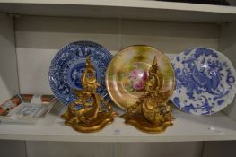 Three decorative plates, a pair of carved and gilded wall brackets and a porcelain ashtray.