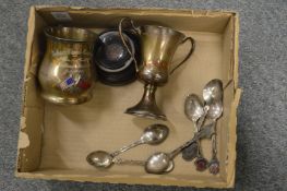 A small silver tankard and other items.