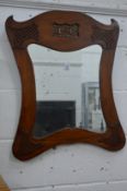 A mahogany framed mirror with pierced decoration.