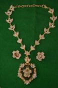 Highly decorative necklace and pair of matching ear clips.