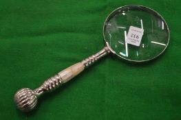 A decorative magnifying glass.