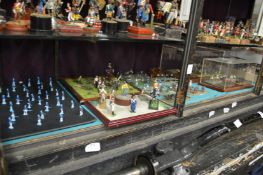 Miniature military figures mounted onto various bases.