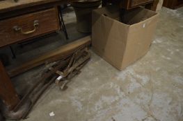 Wrought iron saddle brackets.