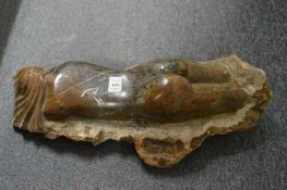 Carlos de Almeida, a carved marble reclining female nude.