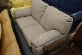 A pale grey upholstered two seater leather settee.