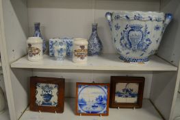 A delft twin handled jardiniere and similar items to include a flower brick and three framed tiles.