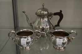 A plated three piece tea service.