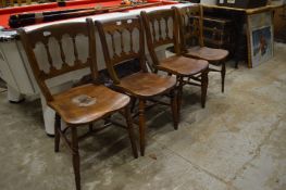 A matched set of four 19th century beech and elm spindle back chairs.