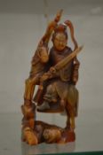 A good Chinese carved horn figure of a deity on horse back.