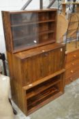 A mid-century rosewood three section wall unit.