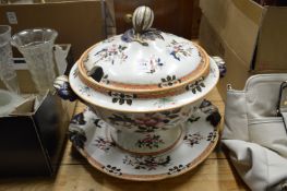 A large tureen cover and stand.