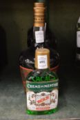 A bottle of Bols Creme de Menthe, Bols peppermint, De Kuyper Creme de Cacao and a small bottle of