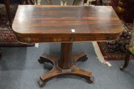 A 19th century rosewood D shaped foldover card table.