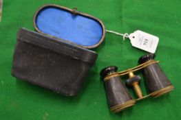 Cased pair of opera glasses.