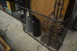 A nursery fender and two coal scuttles.