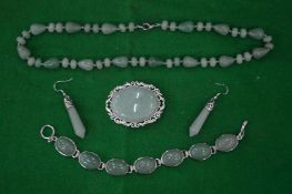 A quantity of jade jewellery.