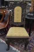 An 18/19th century carved walnut high back dining chair.