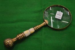 A decorative magnifying glass.
