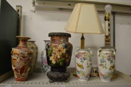 A pottery and bronze mounted oil lamp base and other decorative items.